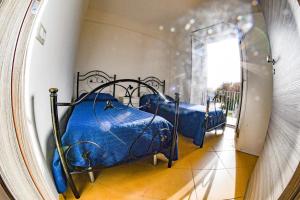 Ένα ή περισσότερα κρεβάτια σε δωμάτιο στο residence scala dei turchi