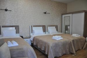 Postel nebo postele na pokoji v ubytování Dream Tower
