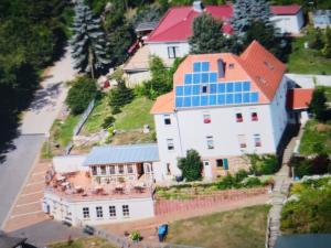 an aerial view of a house with solar panels on it at Mountain Lake View in Güntersberge