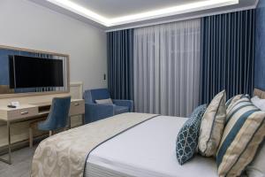 Tempat tidur dalam kamar di Sunway Hotel