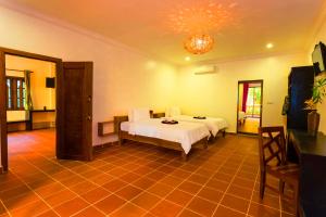 TV a/nebo společenská místnost v ubytování Le Jardin d'Angkor Hotel & Resort