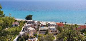 an aerial view of a house next to the beach at Olympion Sunset Halkidiki in Fourka