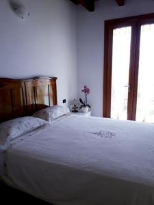 Postel nebo postele na pokoji v ubytování Agriturismo Cascina Lert