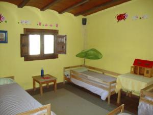 Giường trong phòng chung tại La Quinta de los Enebrales