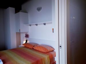 Postel nebo postele na pokoji v ubytování Agriturismo Cascina Lert