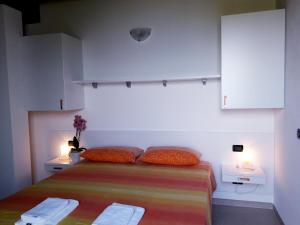 Postel nebo postele na pokoji v ubytování Agriturismo Cascina Lert