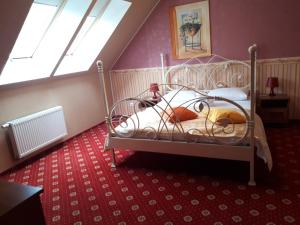 a bedroom with a bed in a attic at Renesance Hotel in Zelenogradsk