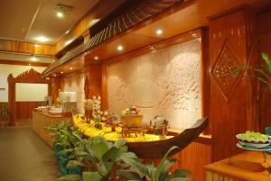 a room with a bunch of bananas on the wall at City Angkor Hotel in Siem Reap