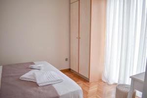 Posteľ alebo postele v izbe v ubytovaní OLIVER SUITES