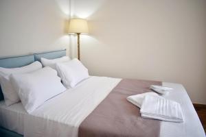 Posteľ alebo postele v izbe v ubytovaní OLIVER SUITES