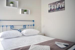 Posteľ alebo postele v izbe v ubytovaní OLIVER SUITES