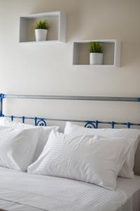 Posteľ alebo postele v izbe v ubytovaní OLIVER SUITES
