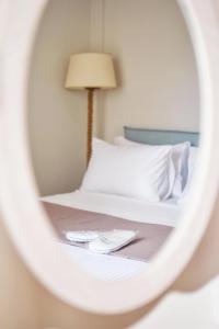 Posteľ alebo postele v izbe v ubytovaní OLIVER SUITES