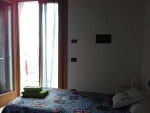 Postel nebo postele na pokoji v ubytování Agriturismo Cascina Lert