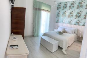 Tempat tidur dalam kamar di Il Belvedere, case vacanza