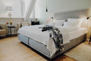 מיטה או מיטות בחדר ב-Romantik Hotel Köllners Landhaus