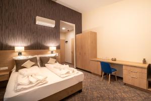 Postel nebo postele na pokoji v ubytování Easy Suites Hévíz + 37 fotografií