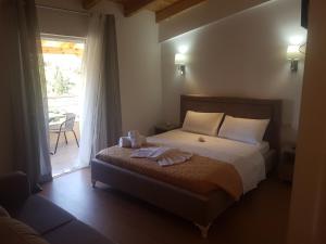 a bedroom with a bed with two towels on it at Villa Xani in Himare +83 photos