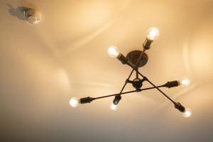 a chandelier is hanging from a ceiling at PINO te COLO in Kanazawa