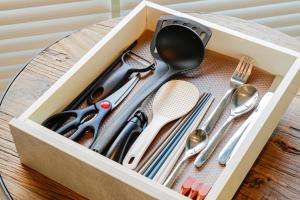 a box filled with utensils on a table at PINO te COLO in Kanazawa