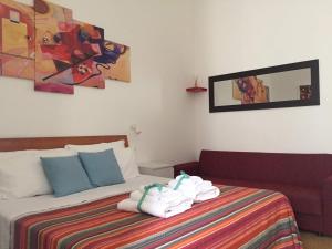 A bed or beds in a room at YooRoom