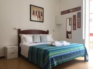 A bed or beds in a room at YooRoom