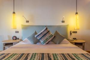 Postel nebo postele na pokoji v ubytování Vilamendhoo Island Resort & Spa