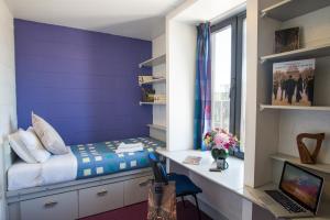 เตียงในห้องที่ Trinity College - Campus Accommodation