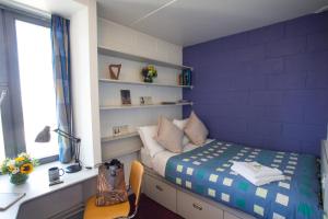 เตียงในห้องที่ Trinity College - Campus Accommodation