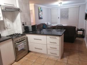 A kitchen or kitchenette at Serengeti Self Catering Units