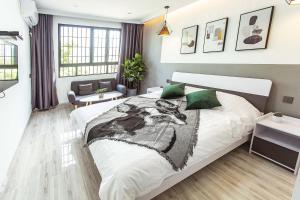 Voodi või voodid majutusasutuse Xiamen Guiran Hostel toas