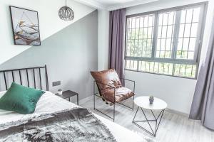 Voodi või voodid majutusasutuse Xiamen Guiran Hostel toas