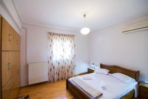 Postel nebo postele na pokoji v ubytování Emerald House