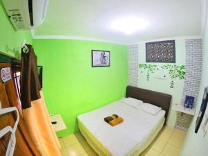 Letto o letti in una camera di nDalem Eyang Dwijo