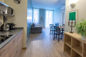 a kitchen and living room with a dining room at Casa Diverio in Stresa