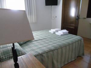 Cama ou camas em um quarto em Hotel El Molino