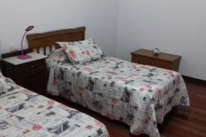 Łóżko lub łóżka w pokoju w obiekcie Piso Top en Plaza Mayor