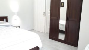 Postel nebo postele na pokoji v ubytování Saturnia Garden