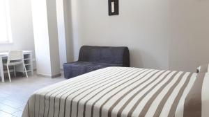 Postel nebo postele na pokoji v ubytování Saturnia Garden