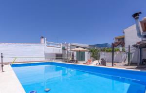 a swimming pool in the middle of a building at Casa Pepita in Cacin