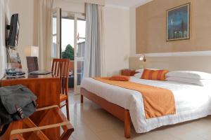 TV a/nebo společenská místnost v ubytování Hotel Michelangelo