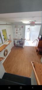 a large room with a wooden floor and a table at Atlantic Sands in Hampton