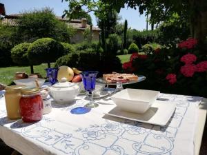 a table with a white table cloth with food on it at Natura e Arte in Pavullo nel Frignano +75 photos