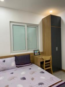 Giường trong phòng chung tại Nha Trang New&Clean