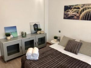 Cama o camas de una habitación en Apartamento Ana Isabel Herrero