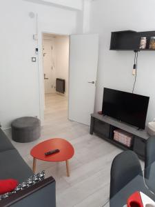Televízia a/alebo spoločenská miestnosť v ubytovaní Apartamento Somosierra a 5 minutos del centro histórico para 7 personas