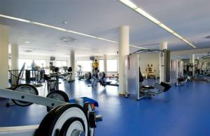 a large gym with a lot of equipment at Tulip Inn Estarreja Hotel & Spa in Estarreja