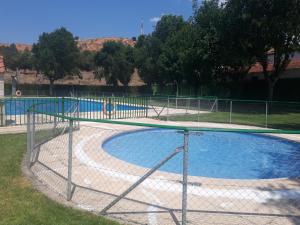 an empty swimming pool with a fence around it at CASA RURAL LA CIJA in Maello