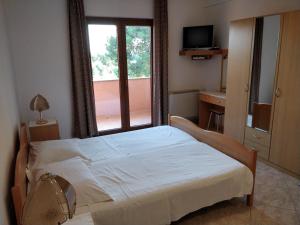 Postel nebo postele na pokoji v ubytování Guest House Caterina