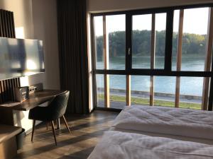 Postel nebo postele na pokoji v ubytování Hotel Donauhof Mauthausen